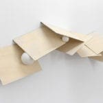 Partitura VI (horizontal)/ Score VI (horizontal), 2012/2019 7 wooden boards, metal hinges, 7 foam balls. Variable dimension (each piece of wood: 40 cm x 32 cm) / apr. 64 x 176 x 32 cm